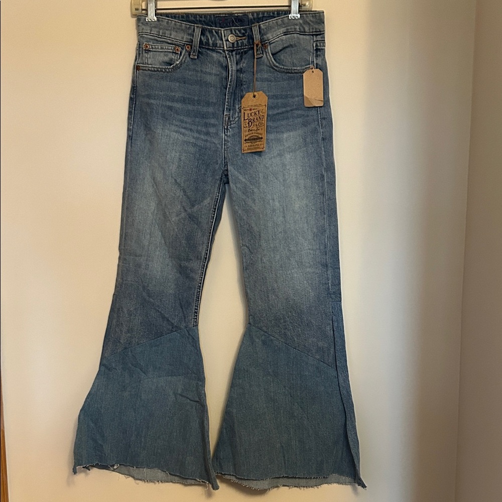Lucky Brand & Co bell bottom faded denim jean split/ frayed bottom size 4/27 NWT